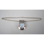 An Eastern Moonstone and White Metal Pendant on a Silver Belcher Chain, Pendant 5.5cms Long