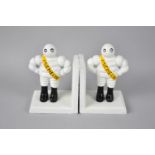 A Pair of Reproduction Cast Iron Cold Painted Bookends in the Form of Michelin Men, 13cms High, Plus