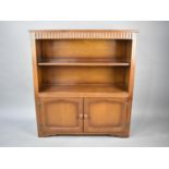 A Mid 20th Century Oak Two Shelf Bookcase with Cupboard Base, 97cms Wide