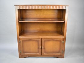 A Mid 20th Century Oak Two Shelf Bookcase with Cupboard Base, 97cms Wide