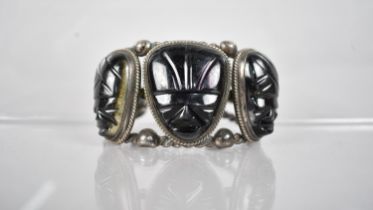 A Heavy Mexican Silver and Onyx 'Mask' Cuff Bracelet, Three Carved Onyx Panels, Largest 31.7x27.