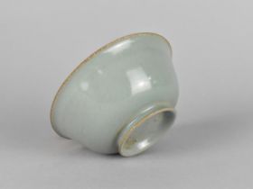 A Chinese Celadon Bowl with Lipped Rim and Short Foot having Three Spur Marks to Base, 14cms