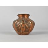 An Indian Copper Shrine Vase Decorated in Relief with Shiva and Snake, 8.5cms High