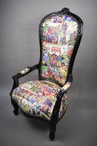 A Reproduction Black Painted Nursing Armchair Upholstered in Marvel Comic Printed Fabric