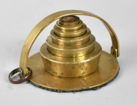 A Set of Six Graduated Brass Weights on Carrier