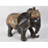 A Modern Gilt Decorated Study of an Elephant, 40cms Long and 38cms High