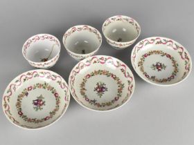 Three 18th Century Porcelain Tea Bowls and Saucers Decorated with Floral Garland Bands