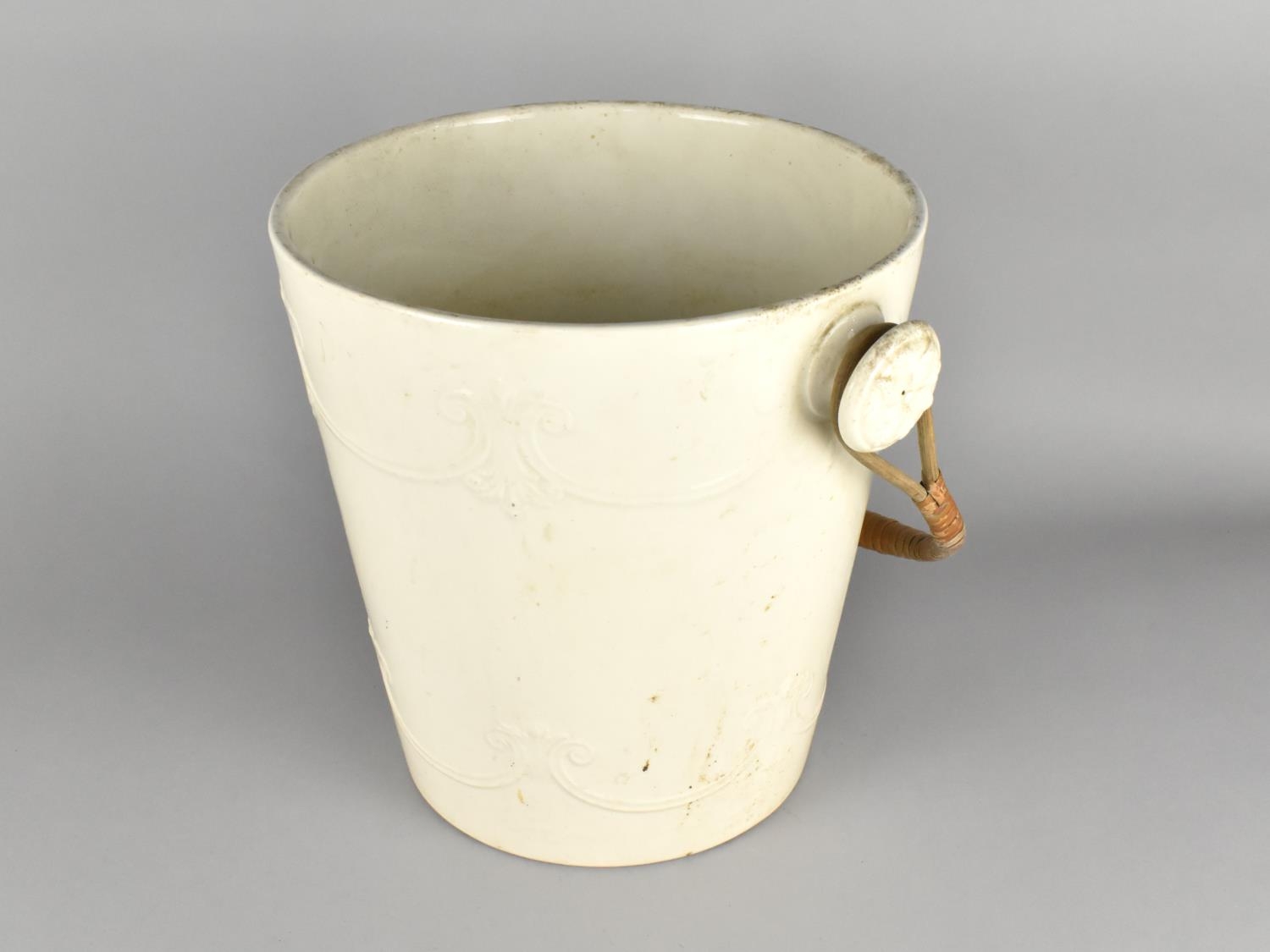 A 19th Century White Glazed Pail with Relief Decoration, 28cm high
