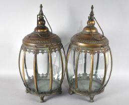 A Pair of Copper Patinated Lanterns with Hinged Lid and Hoop Carrying Handles, 48cms High