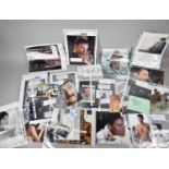 A Collection of Various Signed Photographs From the Films of James Bond to include Monica Belluci,