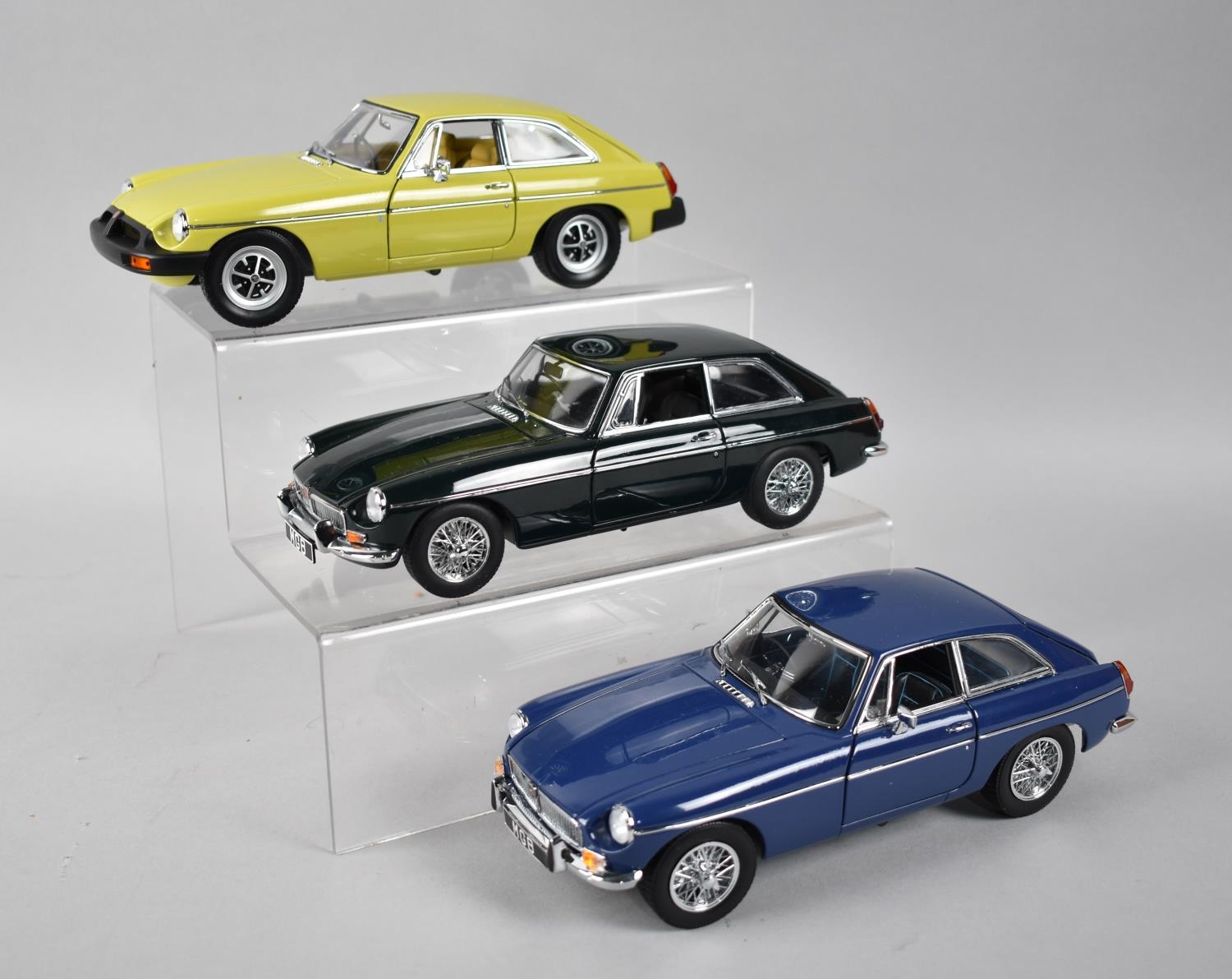 Three Diecast MGB Motorcars, Two By Universal Hobbies, The Other by Auto Art