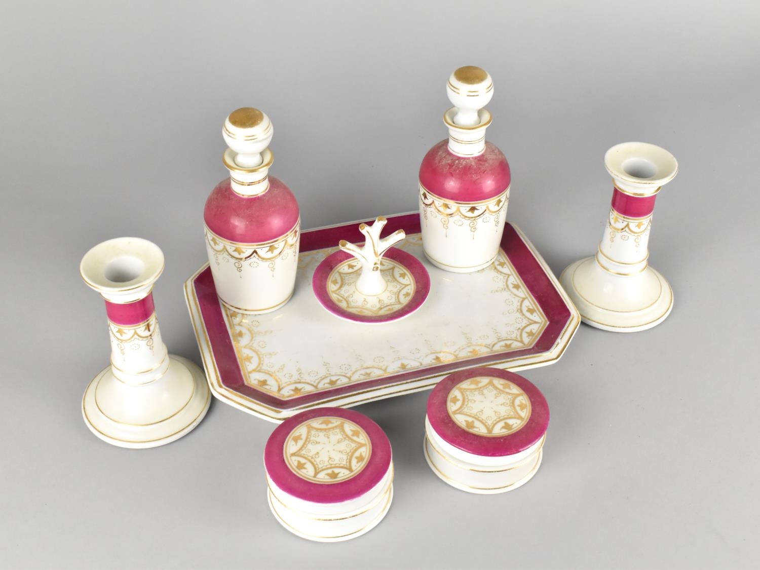 A Late 19th/20th Century Porcelain Eight Piece Dressing Table Set with Gilt and Pink Trim