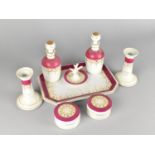A Late 19th/20th Century Porcelain Eight Piece Dressing Table Set with Gilt and Pink Trim