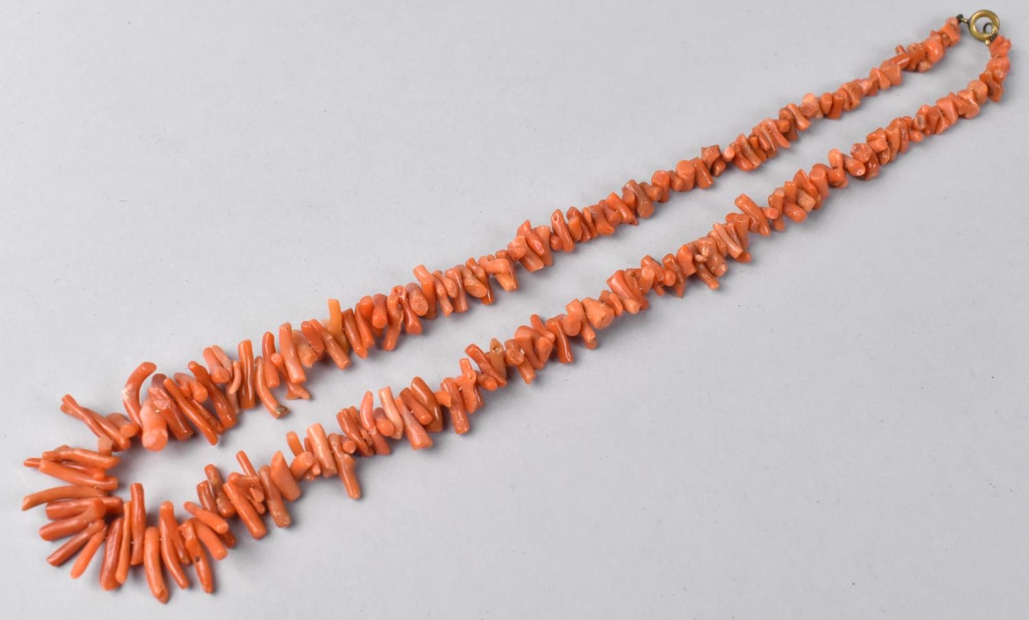 A String of Red Coral Beads of Branch Form, 45cms Long, 22.4gms