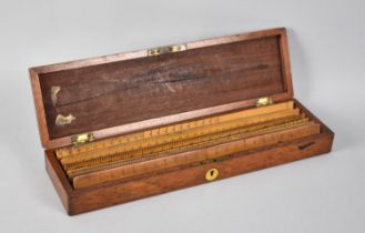 A Late Victorian/Edwardian Mahogany Box Containing Wooden 12" Rulers, 34cms Wide