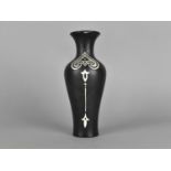 A Shelley Art Nouveau Style Vase Decorated with White and Silver Motifs on Black Ground, 17cm high