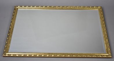 A Modern Bevel Edged Gilt Framed Rectangular Wall Mirror, 93x62cms Overall