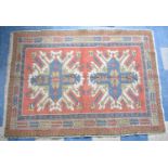 A Patterned Woollen Rug, 175x130cms