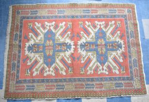 A Patterned Woollen Rug, 175x130cms