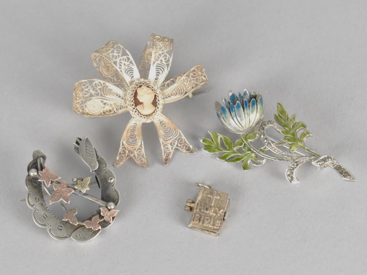 Two Silver Brooches and a Silver Bible Charm Inside Written Lords Prayer and the Ten Comandments,