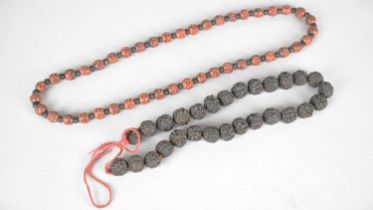 A String of Twenty-eight Japanese Black Rudraksha Mala Beads, 12mm Together with a Natural Zambian