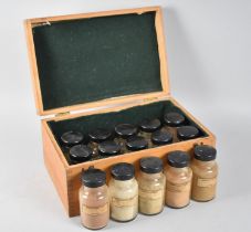 An Edwardian Pharmacognosy Box Containing Fifteen Labelled Jars to include Rhubarb, Cloves, Coffee