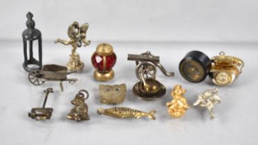 A Collection of Various Novelty Charms and Sundries to include Miniature Compass with Screw Base