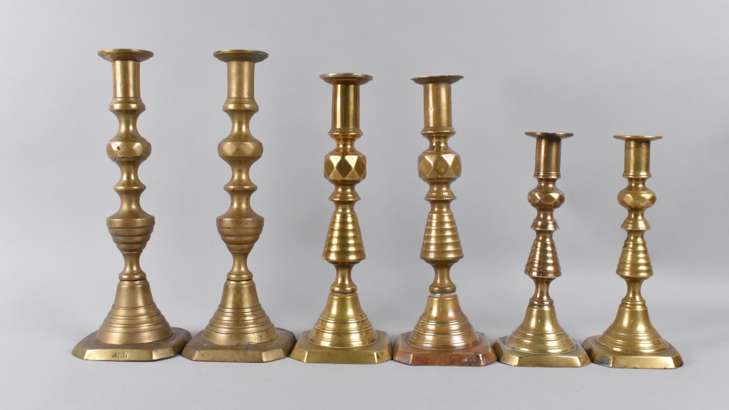 Three Pairs of Victorian Brass Candlesticks, all with Pushers, Tallest 25cms High