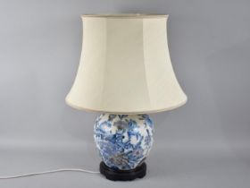 An Oriental Table Lamp and Shade in the Form of a Lidded Ginger Jar, 55cms High Overall