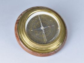 A Circular Brass Compass Mounted on Wooden Plinth, 14.5cms Diameter
