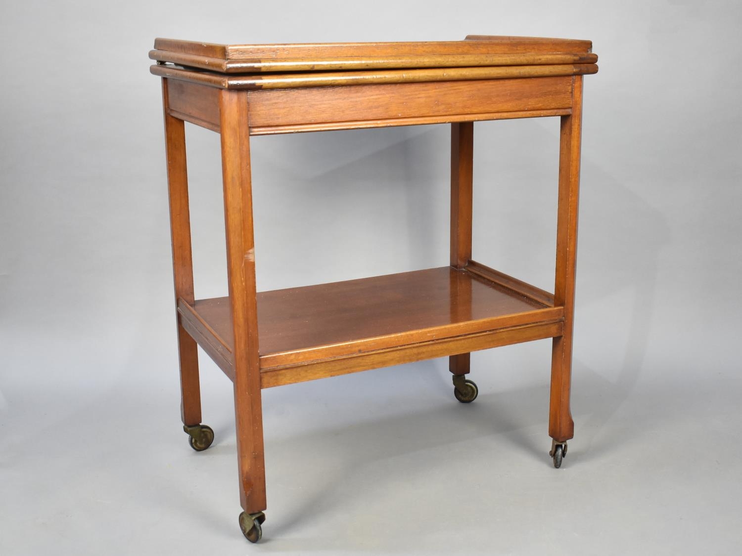 A Mid 20th Century Lift and Twist Two Tier Trolley, 61cms Wide