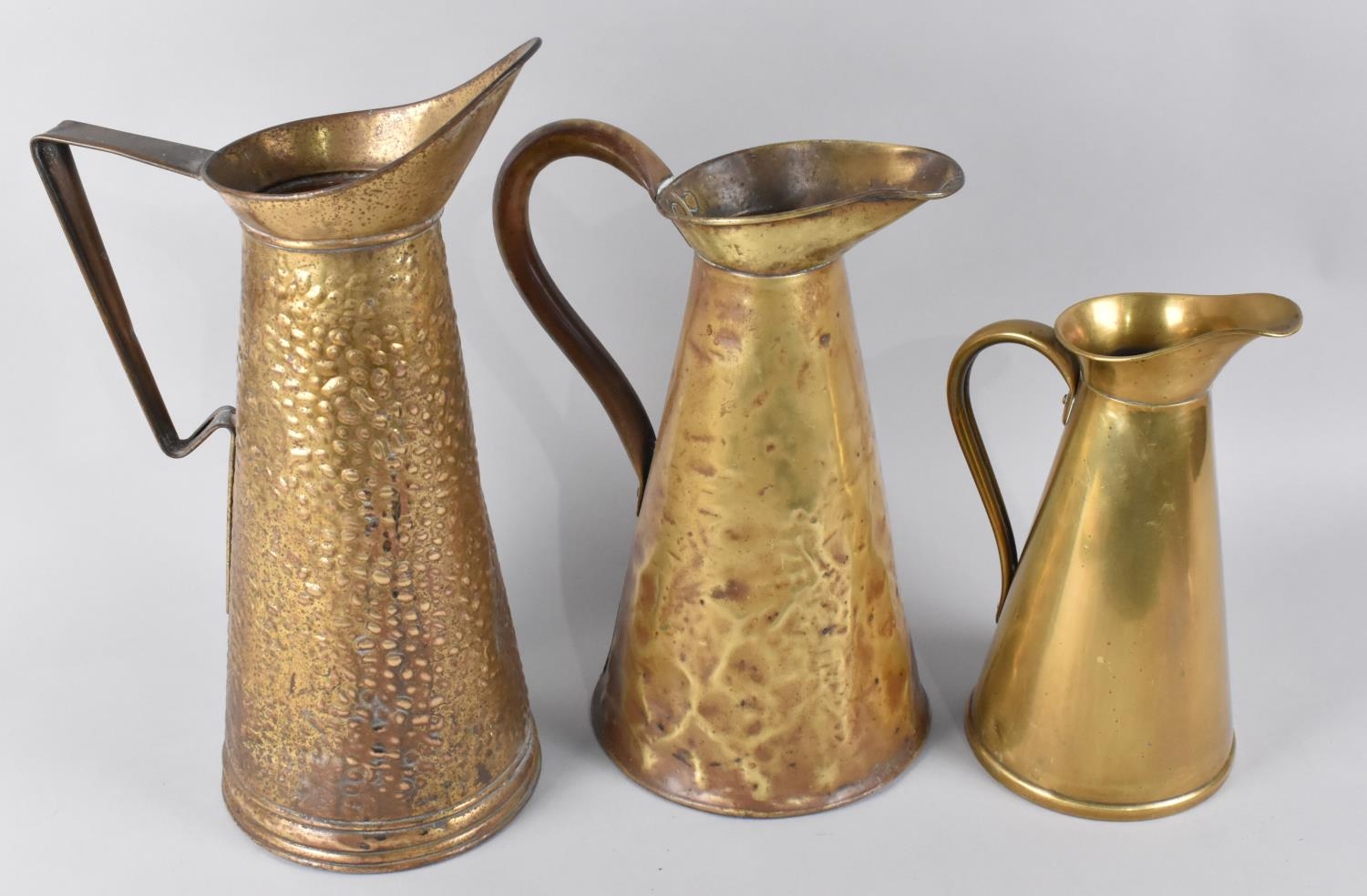 Three Mid/Late 20th Century Graduated Brass Ewers, Tallest 23cms High