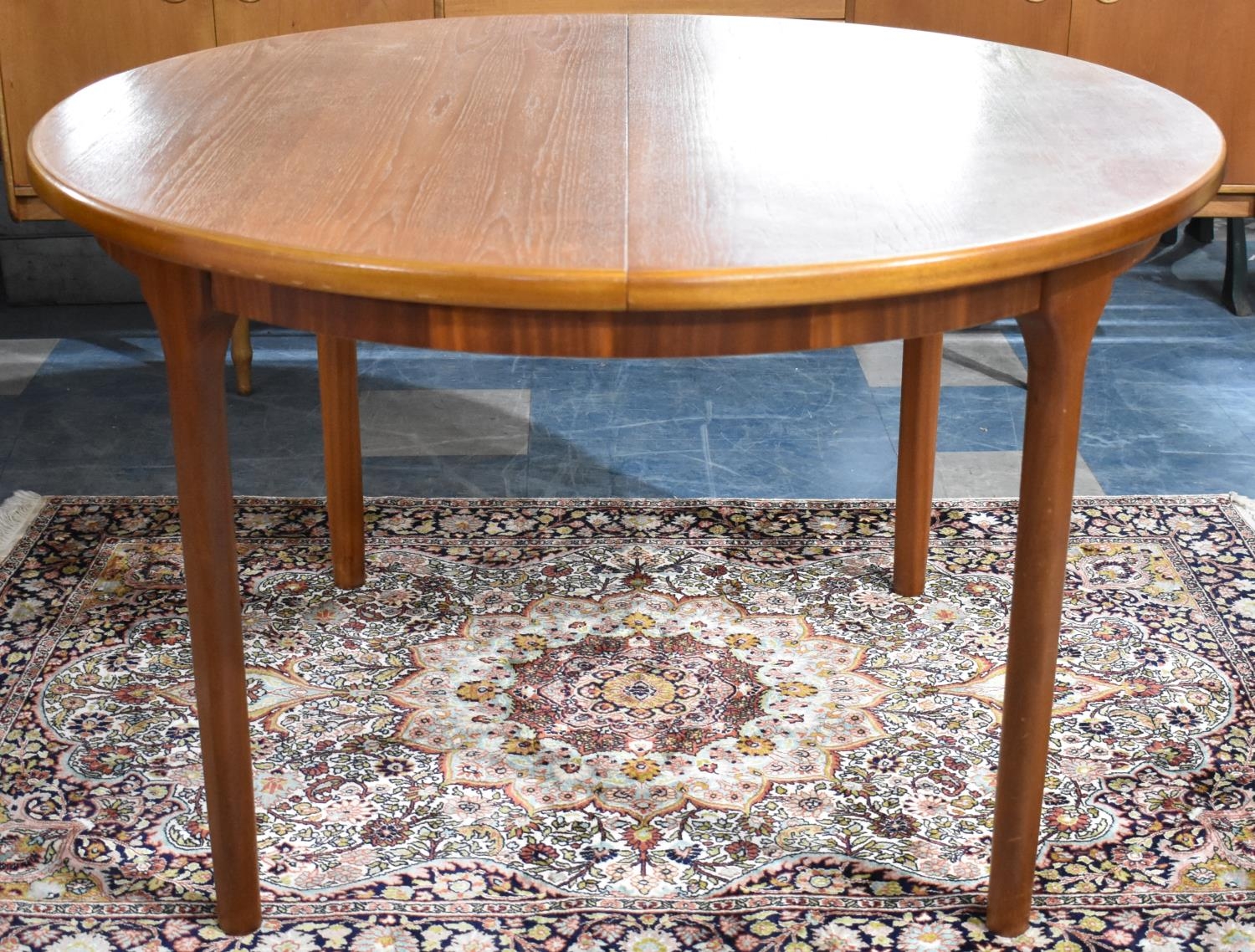 A McIntosh Extending Oval Teak Dining Table, 166cms by 121cms Max