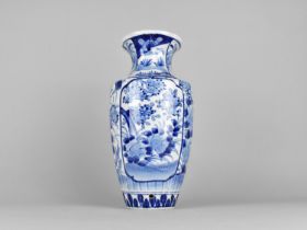 A Japanese Porcelain Blue and White Vase of Reeded Form with Flared Neck, 30.5cm high