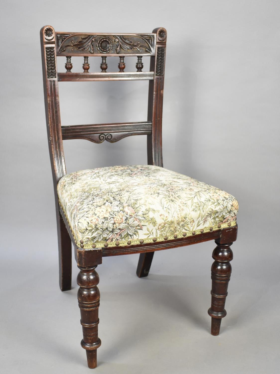 An Edwardian Ladder Back Side Chair with Carved Top Rail
