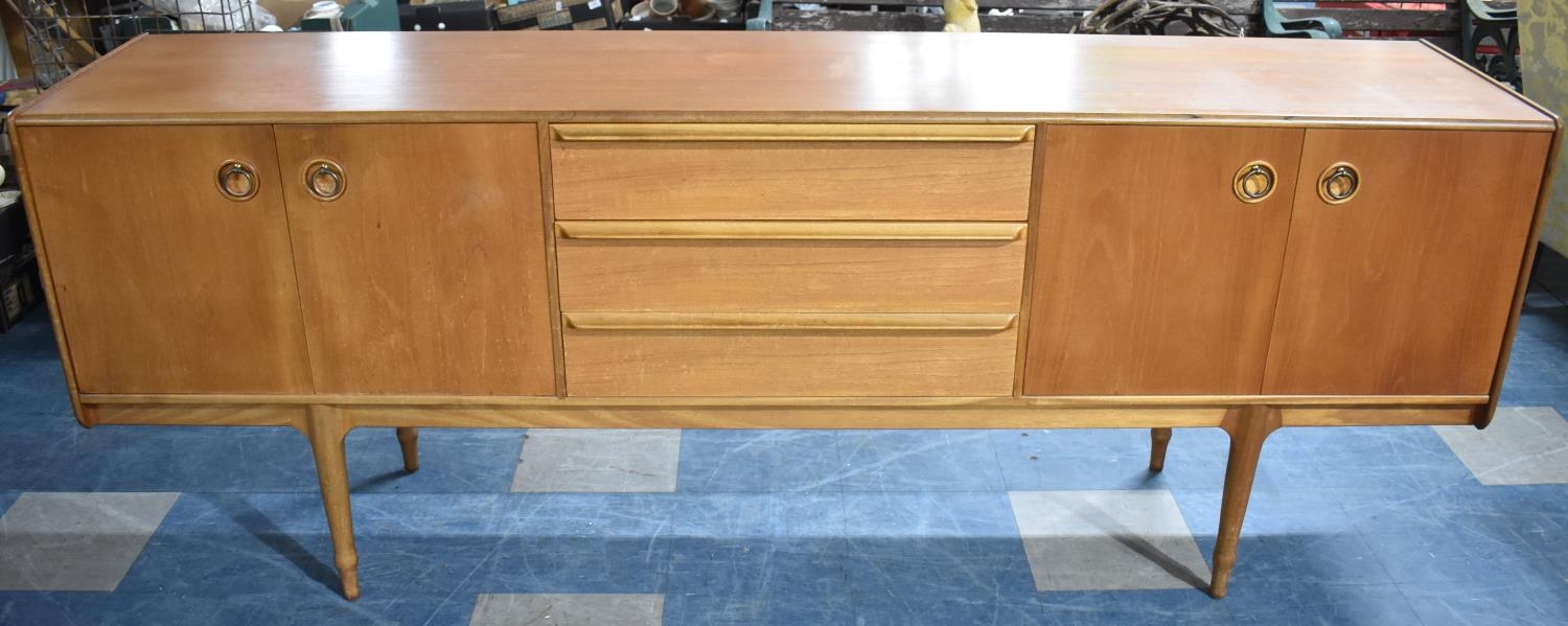 A 1970s McIntosh Teak Sideboard with Three Centre Drawers Flanked by Cupboards Either Side, 213cms