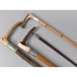 A Collection of Three Riding Crops to include Silver Mounted Malacca Example with Antler Handle by