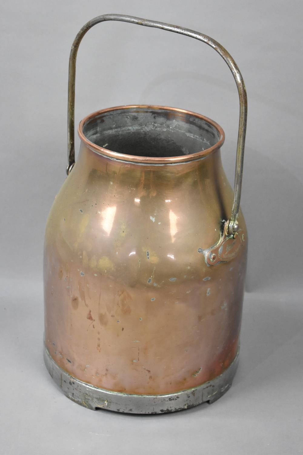 A Vintage Copper Milk Unit Base with Iron Loop Carrying Handle, 39cms High