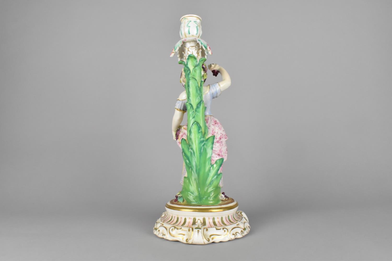 A 19th/20th Century German Porcelain Figural Candlestick Modelled as a Lady Holding Basket of - Image 3 of 4