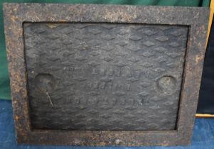 A Heavy Cast Metal Manhole Cover and Frame, 71x57