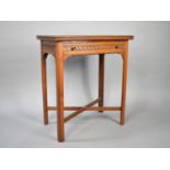 An Edwardian Lift and Twist Occasional Table with Blind Carved Single Long Drawer, 61cms Wide (