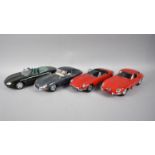 A Collection of Four Diecast Jaguar Models to include Burago, Maisto and Auto Art