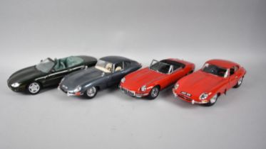 A Collection of Four Diecast Jaguar Models to include Burago, Maisto and Auto Art