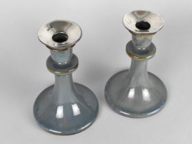 A Pair of Royal Doulton Glazed Stoneware Candlesticks with Silver Tops, 17.5cm high