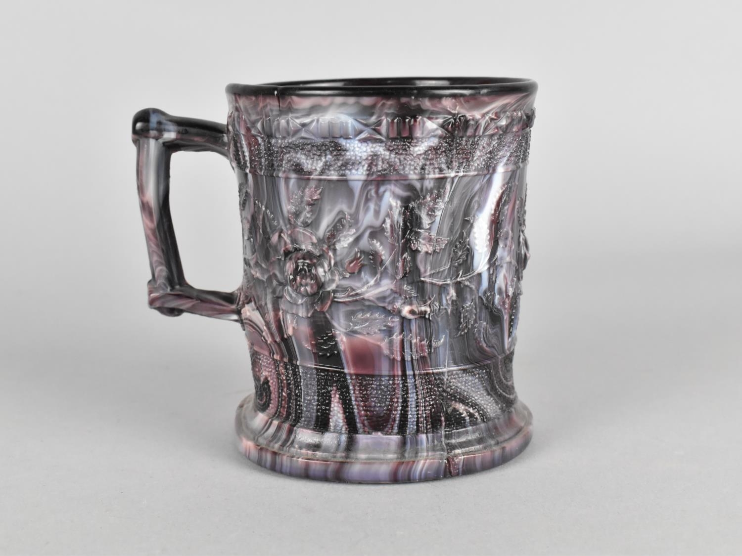 A 19th Century Slag Glass Mug with Relief Decoration, 9.5cm high - Image 2 of 2