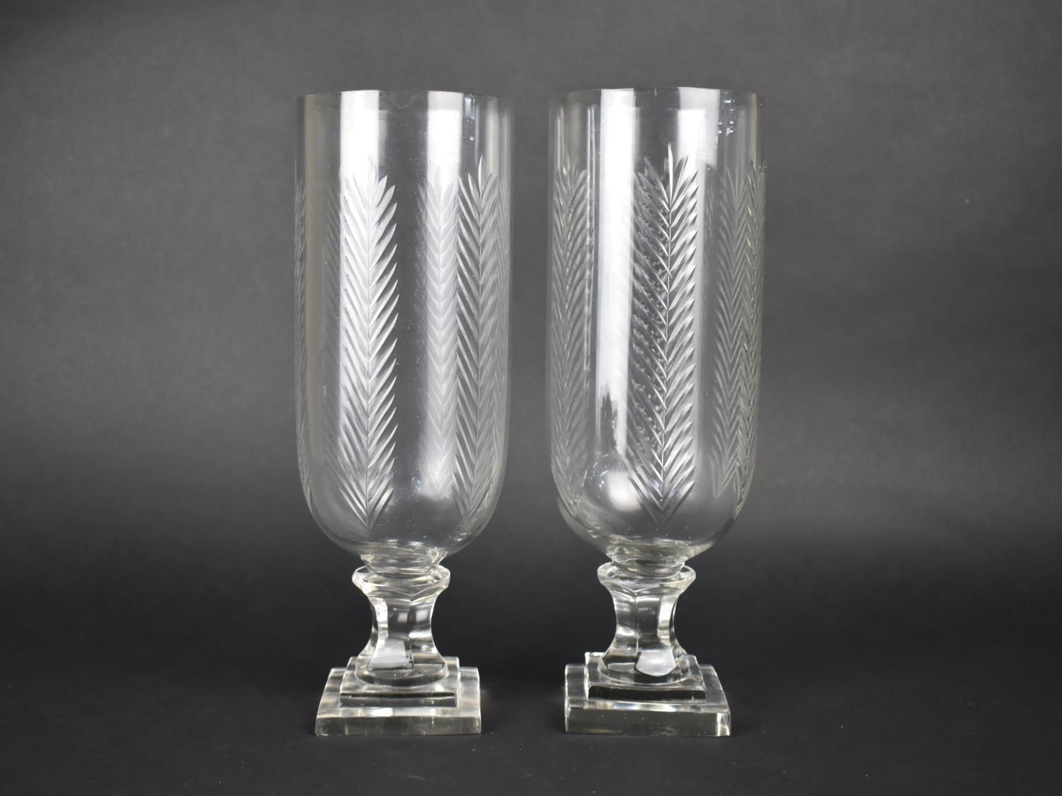 A Pair of Cylindrical Glass Hurricane Lamps, 39.5cms High