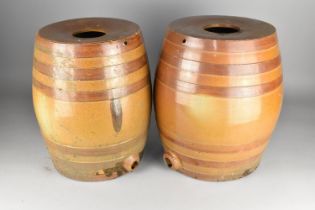 A Pair of Glazed Stoneware Barrels, 38cm high
