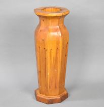 A Modern Wooden Stick Stand in the Form of an Octagonal Vase, 60cms High