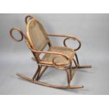 A Vintage Bamboo Framed Cane Seated Child's Bentwood Rocking Chair, Condition issues