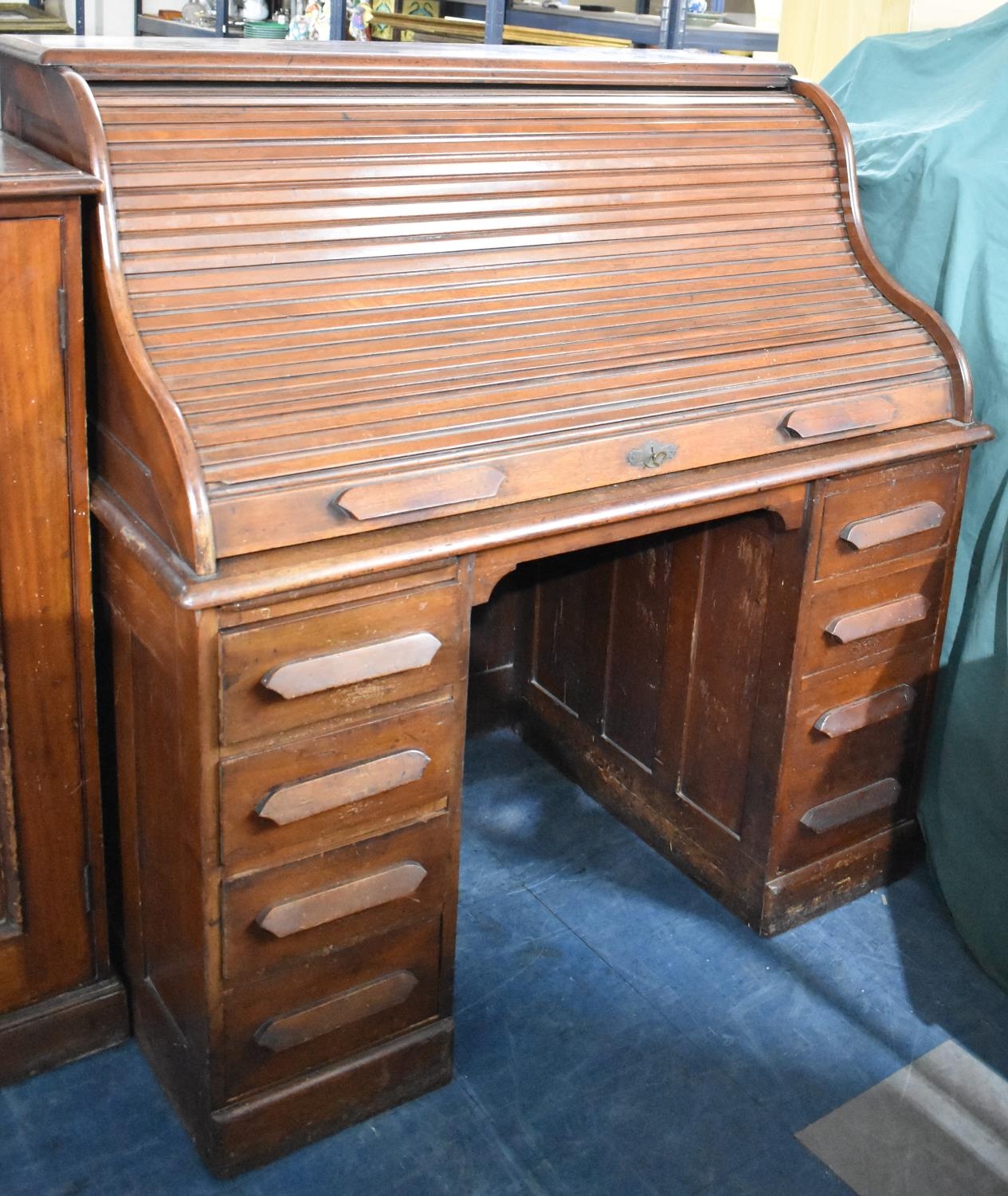 An Edwardian Roll Top Kneehole Desk with Fitted Interior and Four Drawers Either Side Kneehole,